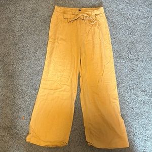 Yellow wide-legged pants with adjustable tie in belt loops